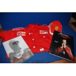 An official Michel Schumacher formula 1 shirt and cap and first edition book Schumacher 2002 and