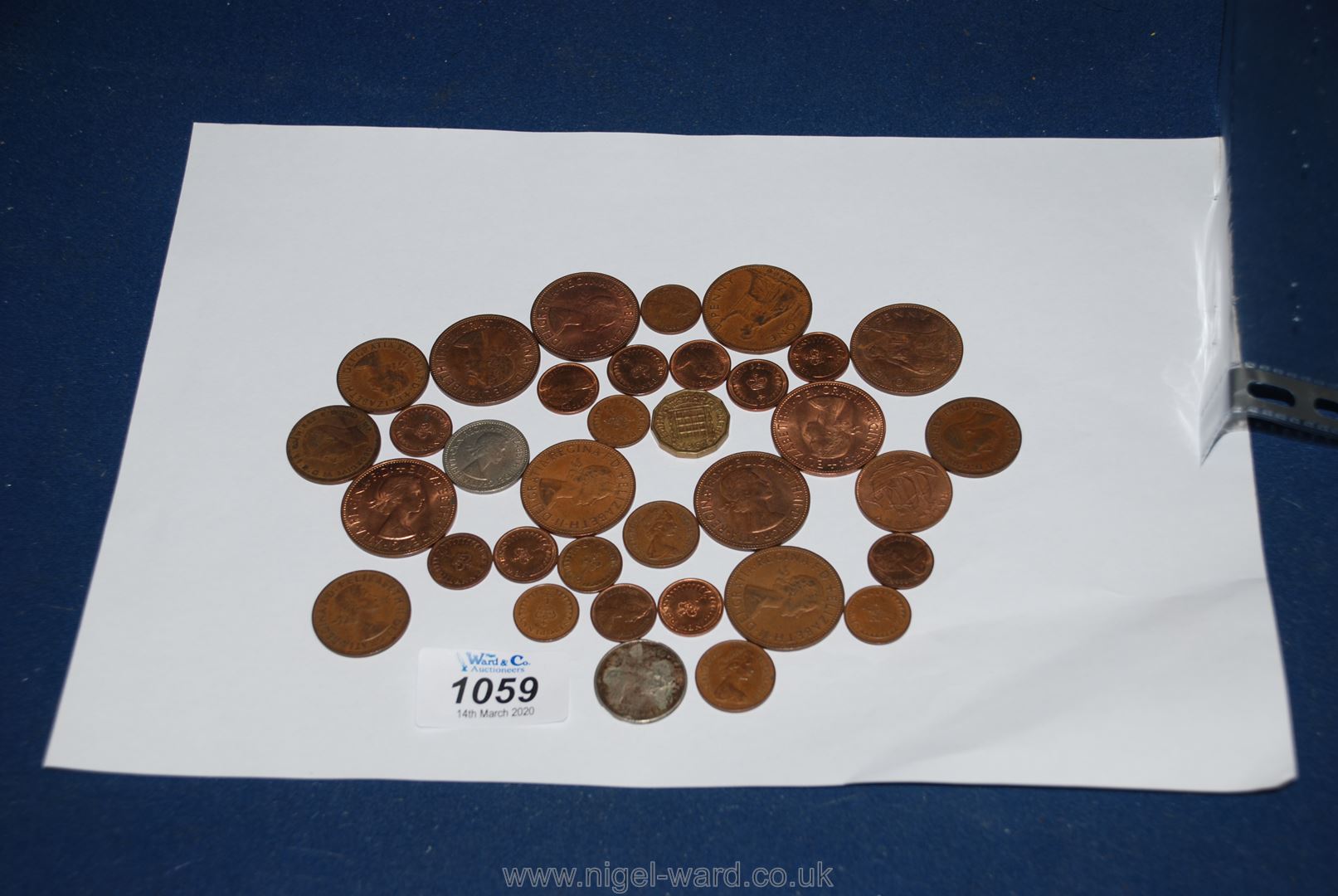 A quantity of pre-decimal British Coins including pennies, farthings, shilling,