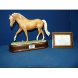 **** A Doris Lindner Royal Worcester figure of a Palomino horse with certificate, no.