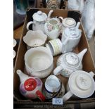 A quantity of Teapots including Portmeirion, Laura Ashley, Donegal Parian jardiniere, etc.