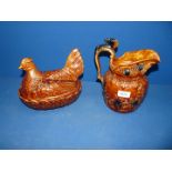 A brown Portmeirion hen on nest and an Arthur Wood brown hunting jug having a horses head on the