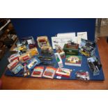 A blue box of boxed sets of Readers Digest Vintage die cast classic cars and motorbikes.