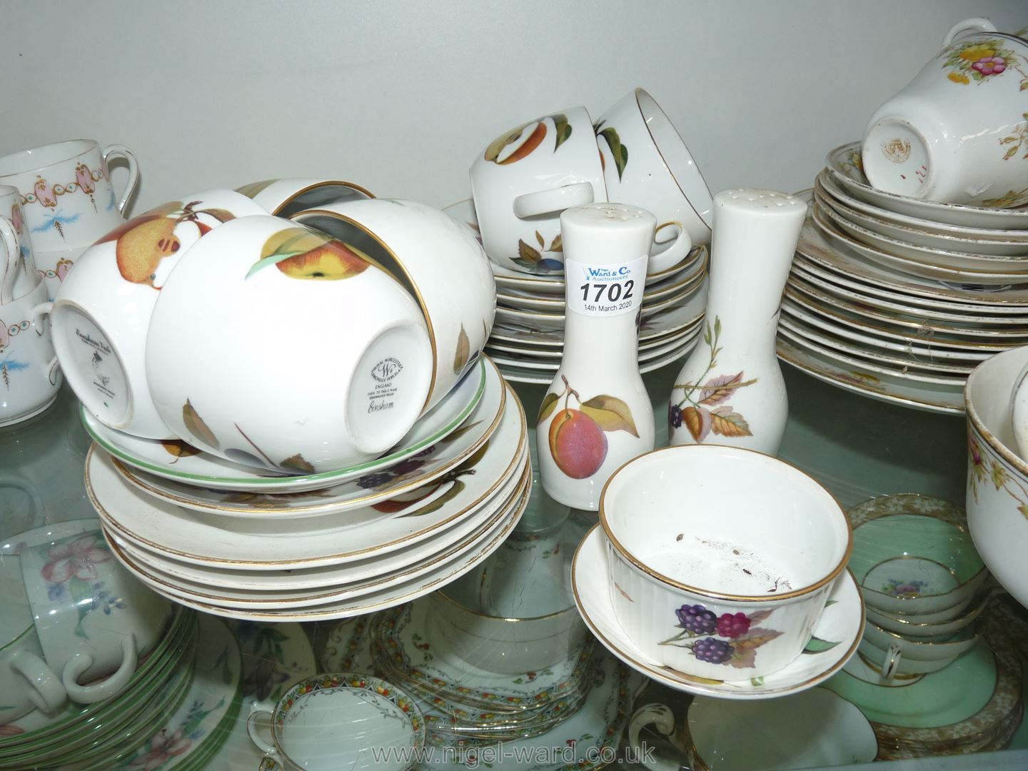A part Royal Worcester 'Evesham' Teaset including eight plates, six cups and five saucers,