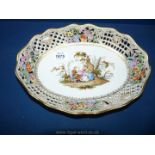 A circa 1900 Dresden or Meissen oval reticulated dessert dish, the border with raised flowers,