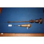 A hand operated spiral shafted drill/bradawl 18 11/16" long overall and a carpenter's multi purpose