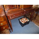 A circa 1900 Mahogany Side Table having low upstand, two frieze drawers and standing on turned legs,