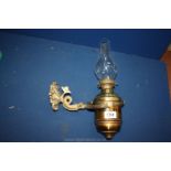 A Gimbal ship's oil Lamp with ornate 'dolphin' wall bracket, by E. Miller & Co.