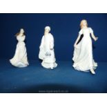 Three Royal Doulton figures 'Friendship, Embrace and Christmas Lantern'.