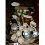 A box of china including Withernsea pottery, squirrels in trees, two dogs, candlesticks,