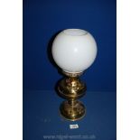 A Brass oil Lamp with white glass shade