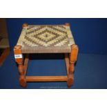 A woven topped, turned legged Stool,