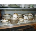 ***A part Teaset by Tudor Fine china, white ground with gold rims and embossed flowers.