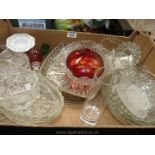 A quantity of pressed glass plates and vases including red bud vase.