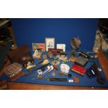 A box of miscellanea including a wooden box, brass wall bell, Instamatic camera, glasses, horse,