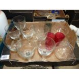 A quantity of glass including six embossed wine glasses, three small cranberry glasses,