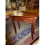 A darkwood single swing leg flap-over Card Table standing on swept legs,