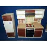 A quantity of vintage Sindy kitchen units.