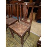 An Oak Georgian design fretwork splat solid seated Dining/Side Chair with peg-joined frame.