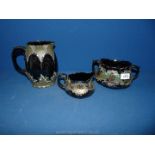 Two Victorian Jugs and sucrier in green, black and gold, a/f.