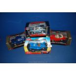 Four Burago model cars including VW Beetle, Freelander,