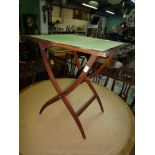 A Mahogany framed folding Coaching Table with green baize top, 24'' square x 27 5/8'' high.