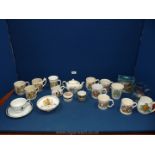 A box of commemorative cups, Royal Doulton beaker, small teapot, jugs, etc.