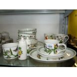 A box of various Portmeirion 'Botanic Garden' tableware including cereal bowls, cups, saucers,