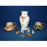 A Beswick Wren, two Wade tortoises, goose, cat with moving head, Bovey pottery mugs,