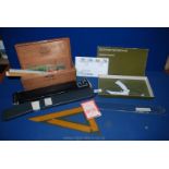 A wooden cigar Box and contents, including cigarette cards, First Day cover, rulers, etc.