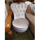 A pearlescent draylon upholstered buttoned back Boudoir Chair