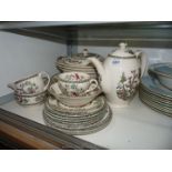 A quantity of Johnson Bros. Indian Tree china including tureens, coffee pot, serving platters, etc.