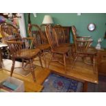 An appealing contemporary set of six solid wood seated Stickback crinoline stretcher Dining Chairs