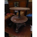 A Regency design Mahogany three tier circular Dumb Waiter having circular shelves, 24'' diameter,