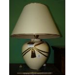 A Louis Drimmer table Lamp and matching cream shade (with original labels).