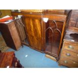 A 1930/40's Mahogany china Display Cabinet having a flame Mahogany central door flanked by glazed