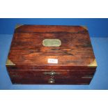 A wooden Box with brass corners and brass plaque in centre with drawer under