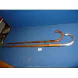 A silver handled walking Stick, a/f and a walking Cane.
