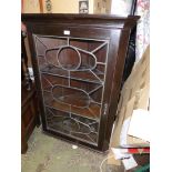 A dark Oak wall hanging Corner Cabinet, the door with most unusual pattern leaded glazing,