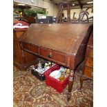 An unusual Victorian Oak writing Desk raised on turned legs and having two frieze drawers,