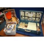 A vintage Picnic Hamper 'Sirram' blue case with cream plastic ware,