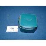 An Osprey of London leather trinket Box with zip in dark green