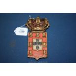 A Royal interest Crown of Portugal: a carved wood and polychrome escutcheon in the form of the