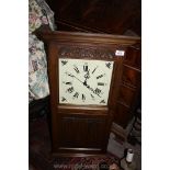 An Oak cased Wall Clock with linen fold panels