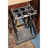 An unusual cast iron stick/umbrella Stand with drip tray (cracked) to the base,