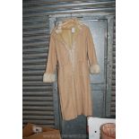A ladies long sheepskin Coat, light beige, size 44.