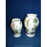 A graduated pair of Portmeirion baluster shape vases,
