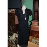 A black crepe-de-chine Dress with matching bolero.