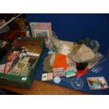 Various craft items for sewing and knitting together with an old Teddy bear kit.
