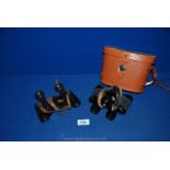 A Carl Zeiss Jena pair of Binoculars and a leather cased pair of Ilite 8 x 25 binoculars.