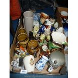 A box of china to include three Wade tankards, Toby jugs, Staffordshire flatback cavalier etc.